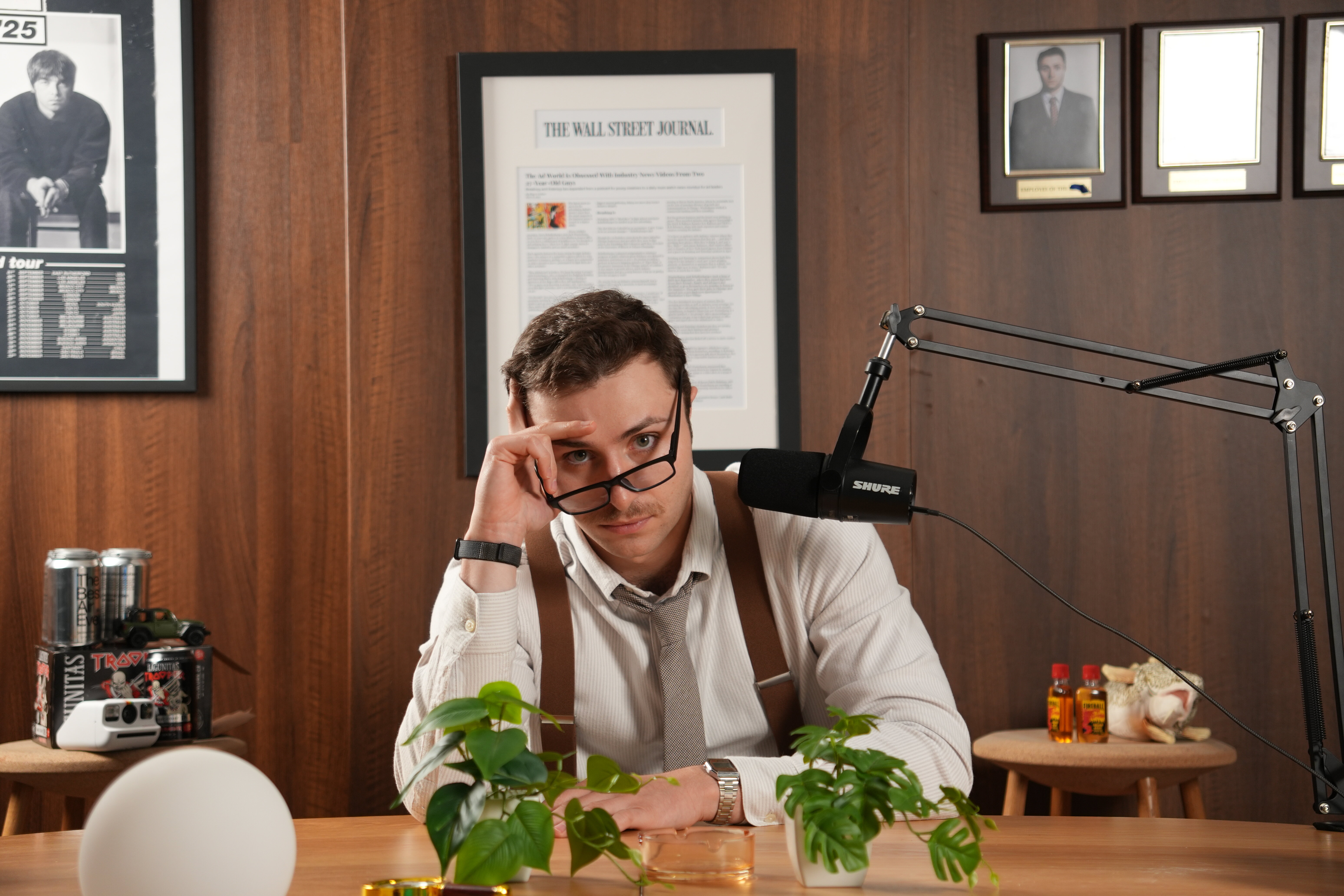 The Last Advertising Podcast host at his desk with a Shure mic