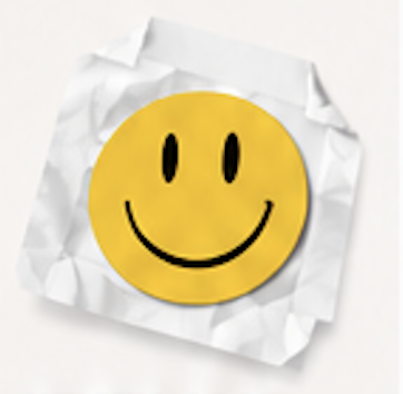 Smiley face sticker on crumpled paper